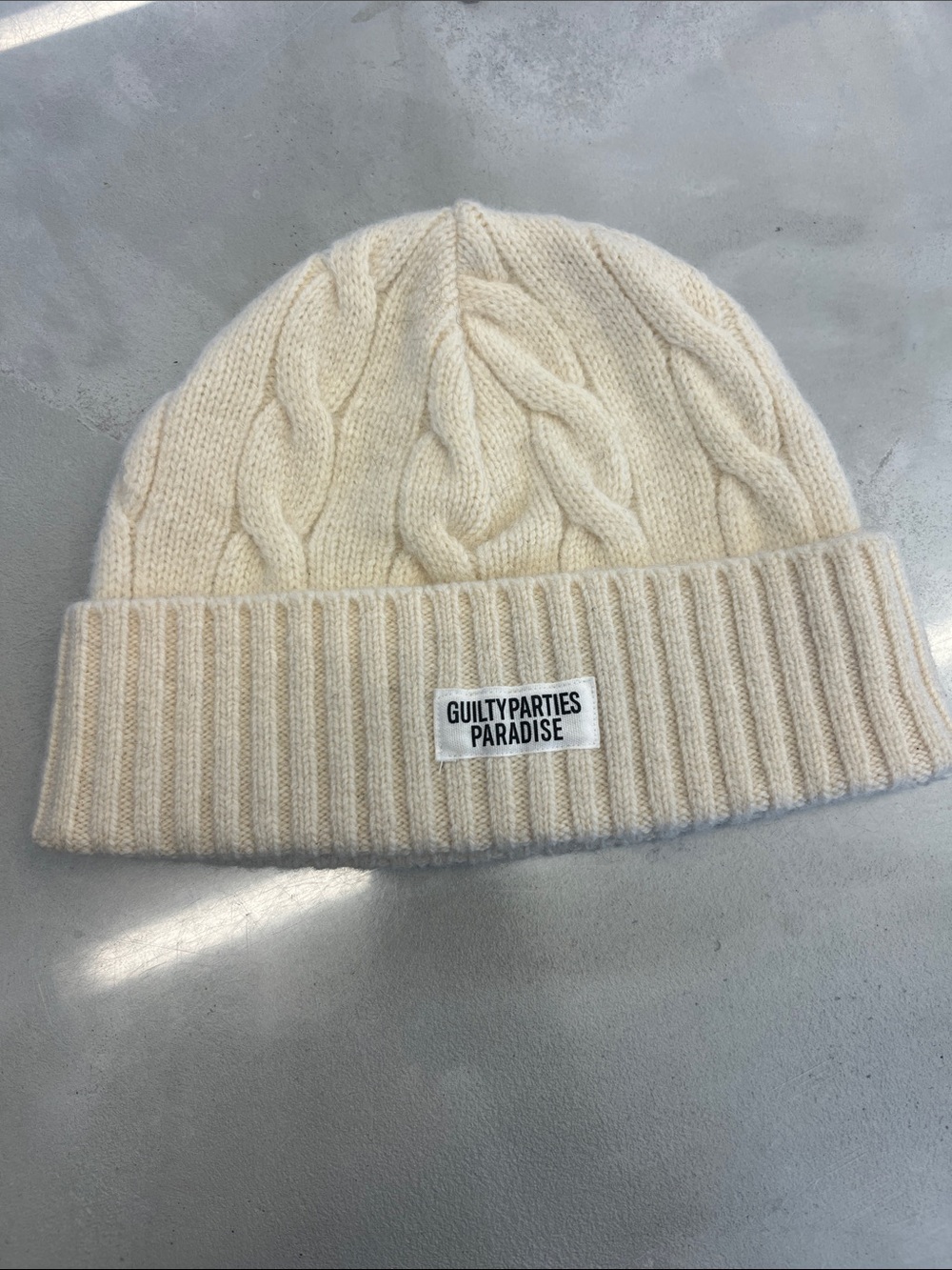 Guiltyparties Paradise Cable Knit Beanie in Cream